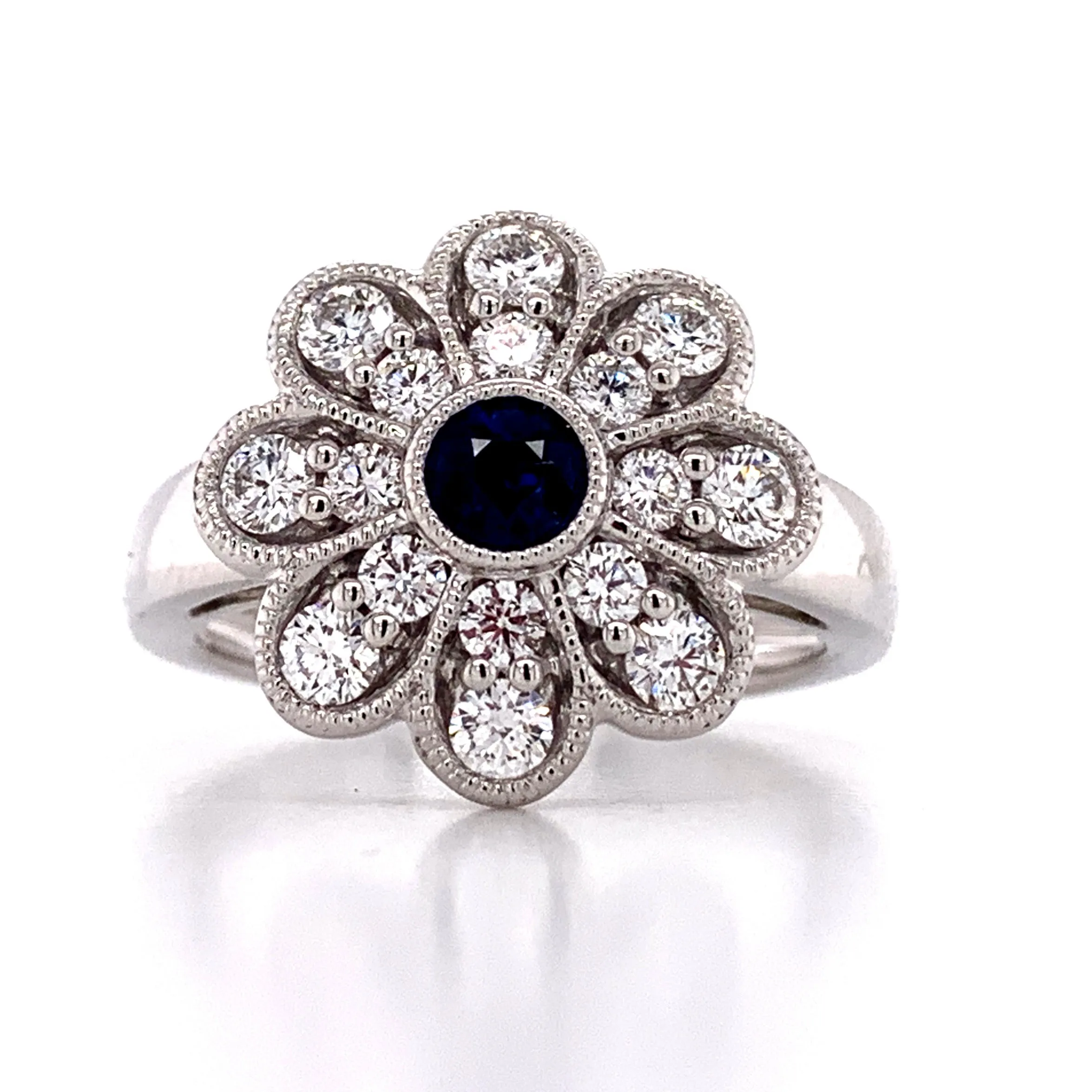 0.98CT TW SAPPHIRE AND DIAMOND ART-DECO STYLE FLOWER RING