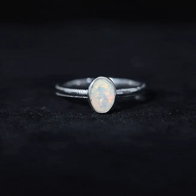 1 CT Bezel Set Oval Ethiopian Opal Solitaire Ring with Beaded Gold