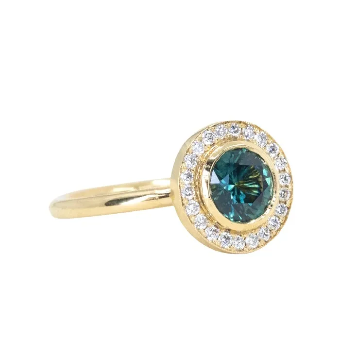 1.22ct Deep Teal Montana Sapphire With Bezel Set Diamond Halo In 18k Yellow Gold