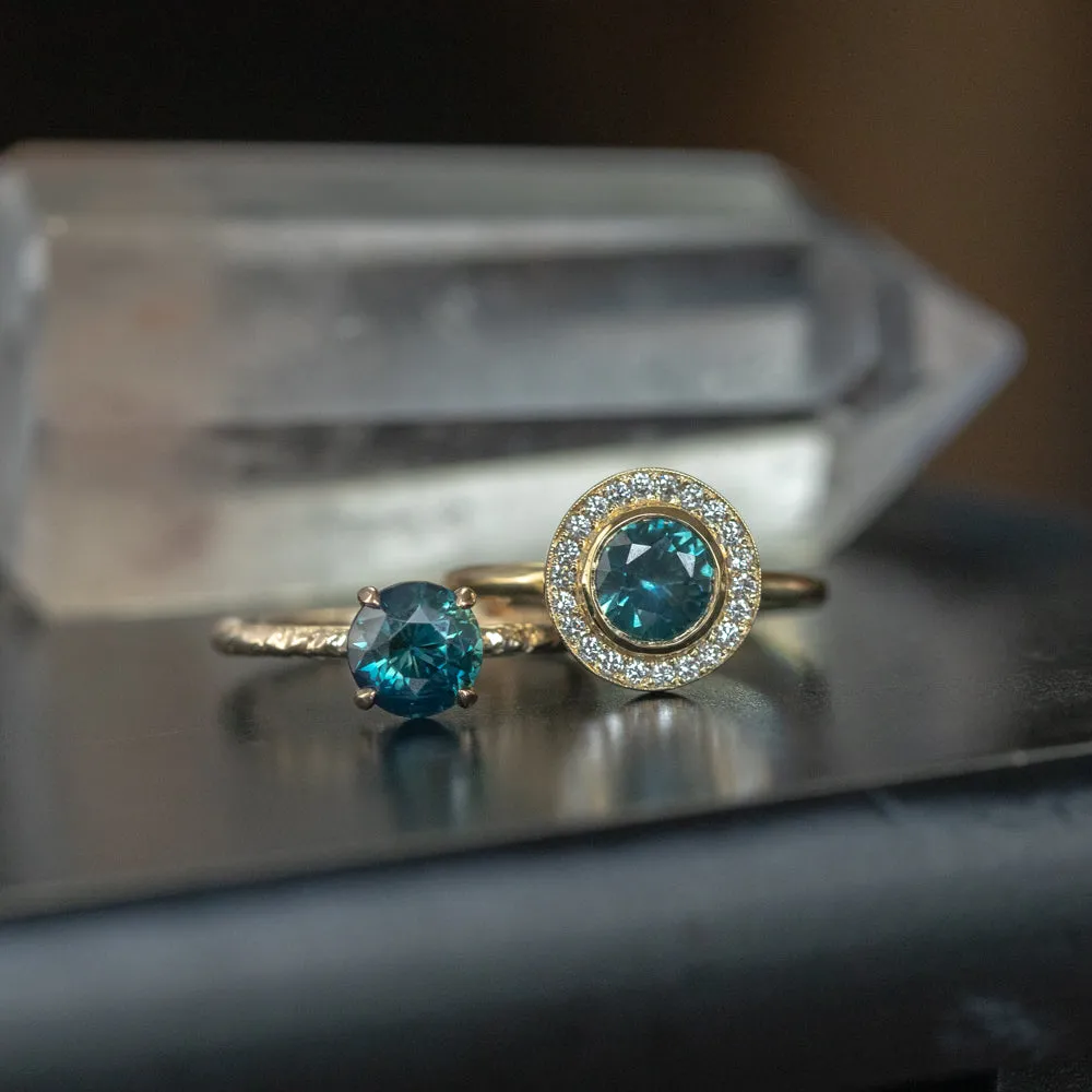 1.22ct Deep Teal Montana Sapphire With Bezel Set Diamond Halo In 18k Yellow Gold