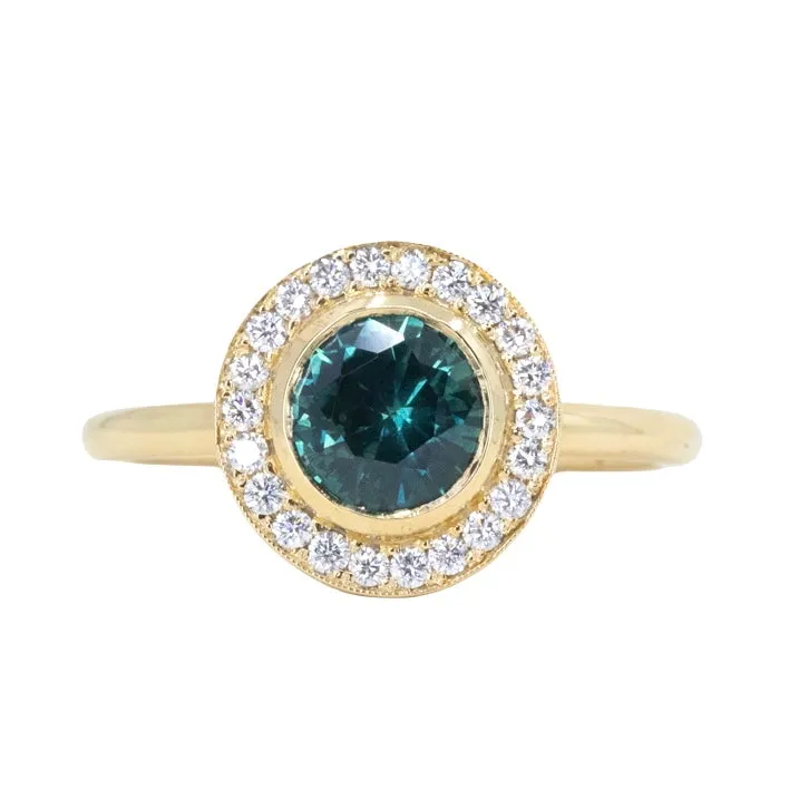 1.22ct Deep Teal Montana Sapphire With Bezel Set Diamond Halo In 18k Yellow Gold