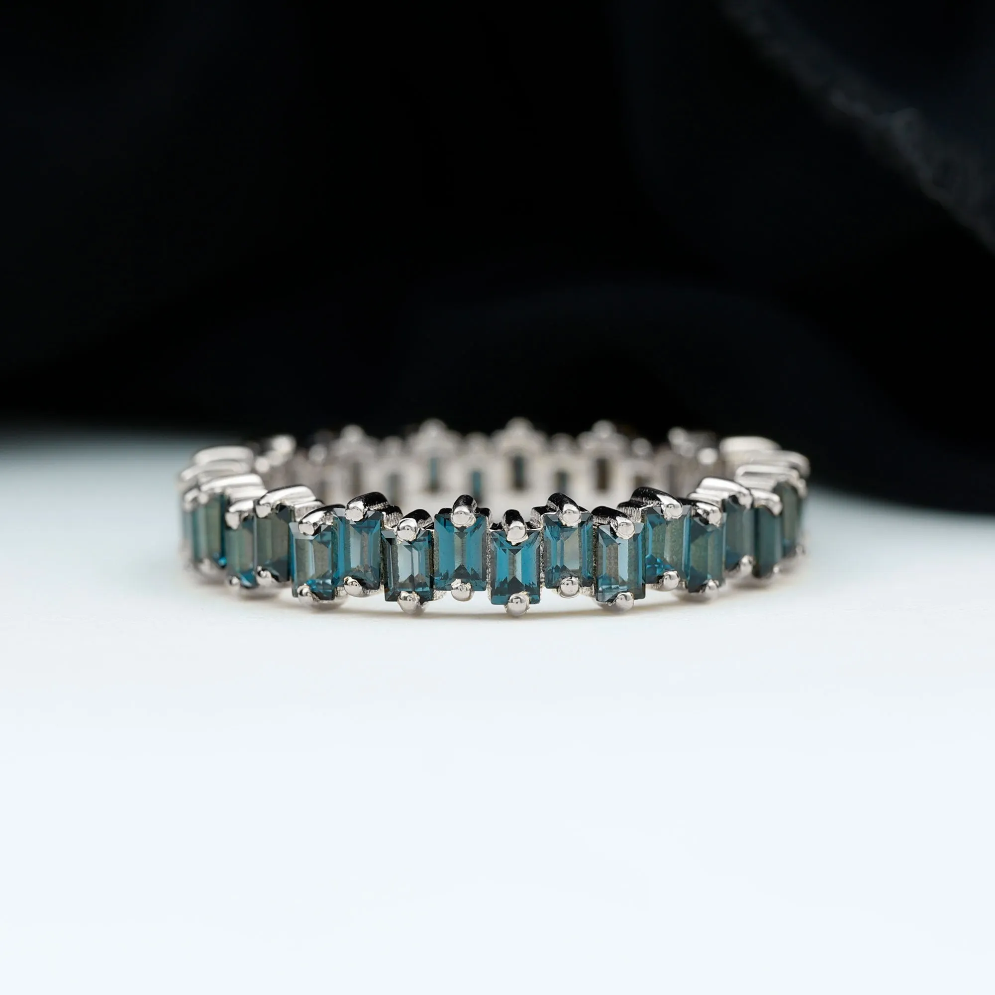 Baguette Cut London Blue Topaz Uneven Eternity Ring in 2 Prong Setting