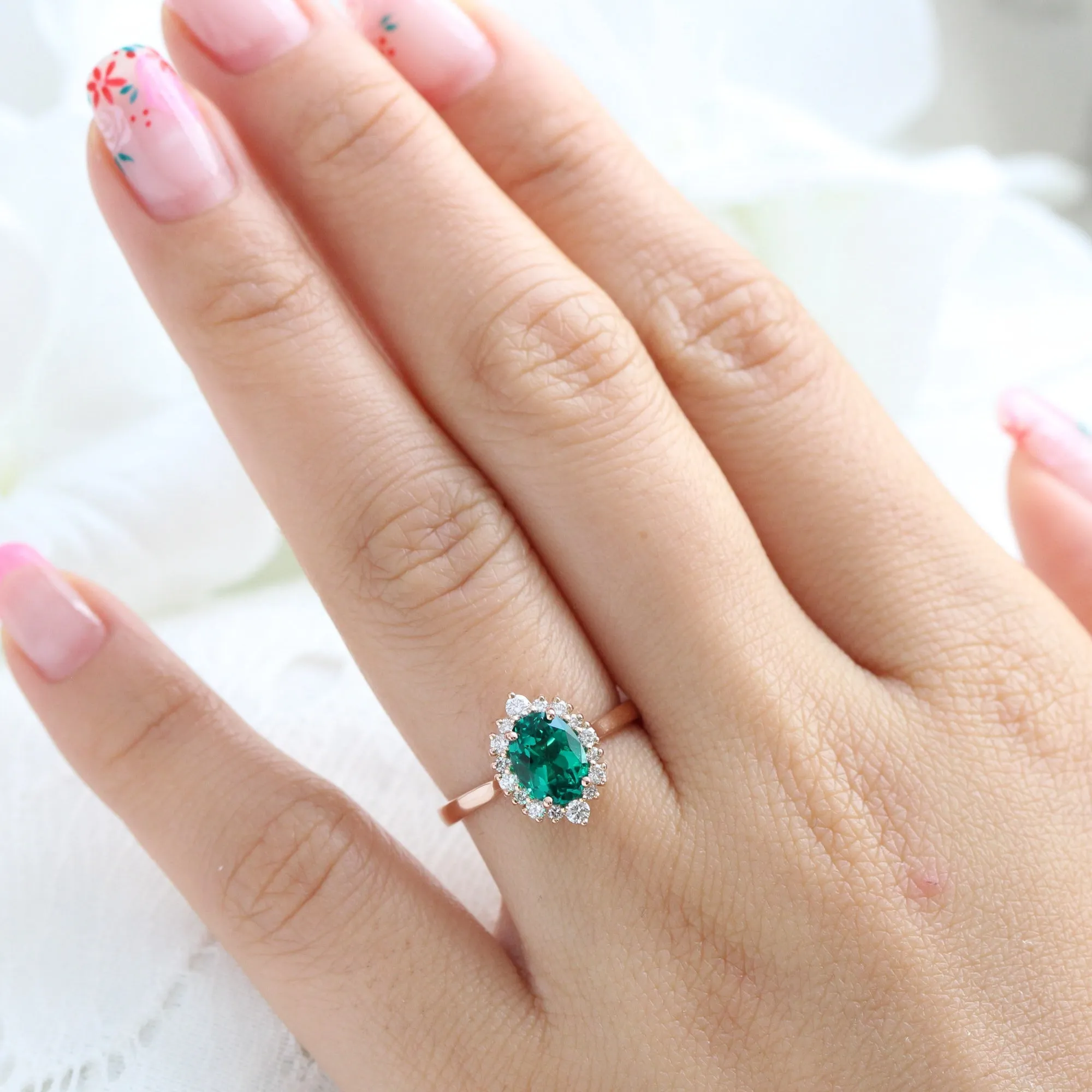 Oval Emerald Engagement Ring in Tiara Halo Diamond Tapered Band