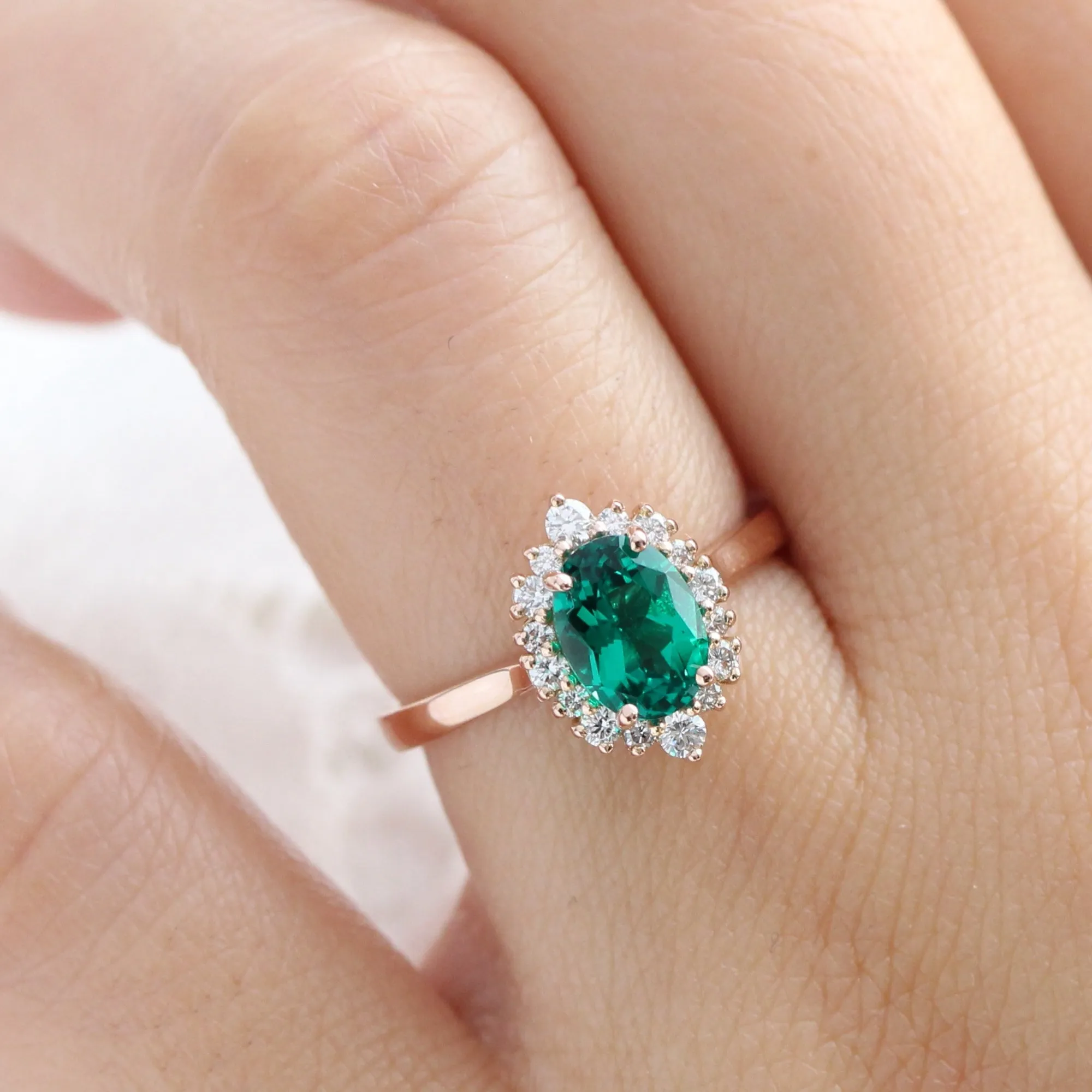 Oval Emerald Engagement Ring in Tiara Halo Diamond Tapered Band